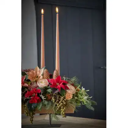 Winter bouquet with poinsettias, pinecones and dried flowers